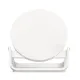 Belkin BOOST UP 10W Wireless Charging Stand displayed on a desk with a smartphone charging