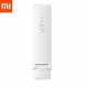 MI WiFi Amplifier 2 displayed on a desk, enhancing WiFi signal strength and coverage in homes and offices.